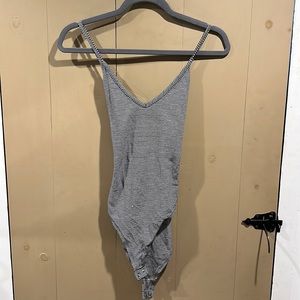 Black and white striped bodysuit. Crisscross backing.